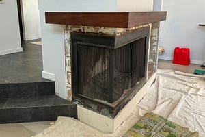 Fireplace repairing work with cloth protectors